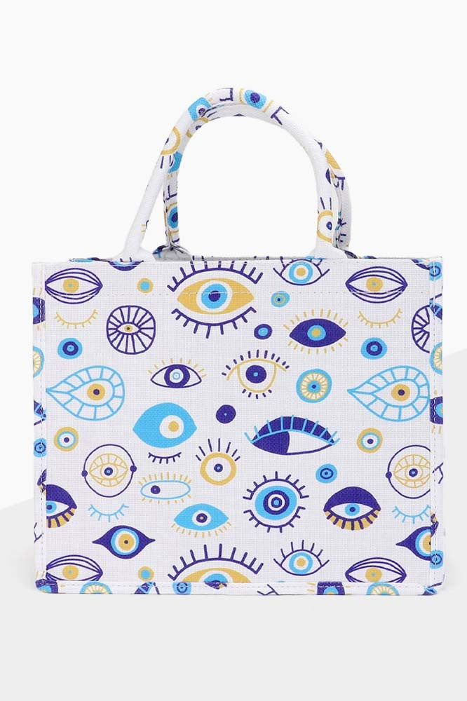 Featuring a evil eye print tote bag with zip closure in the colors blue gold and white 