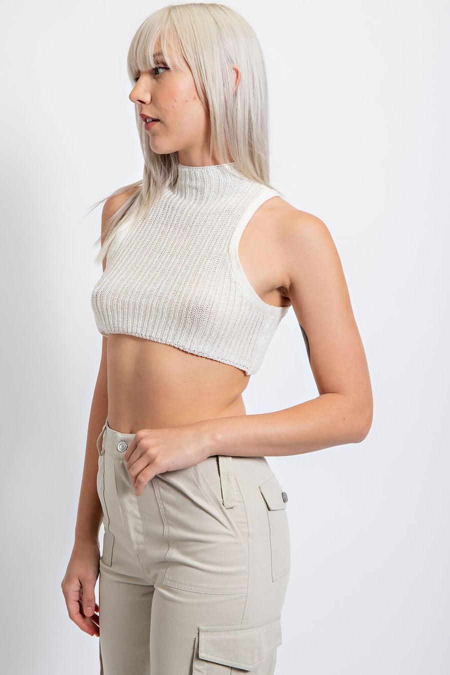 Cropped high neck tank top with button closure.