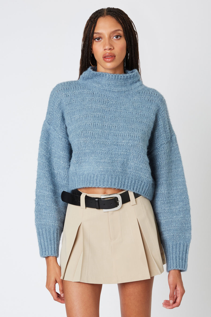 Ribbed turtle neck sweater in the color slate blue. 