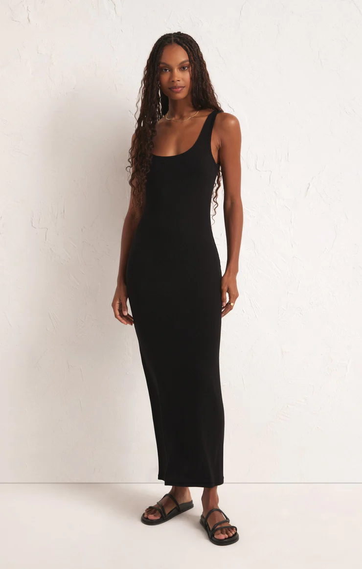 Maxi ribbed dress with a scooped neckline in the color black. 