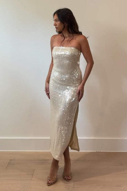 Featuring a strapless sequin mid dress with a side slit