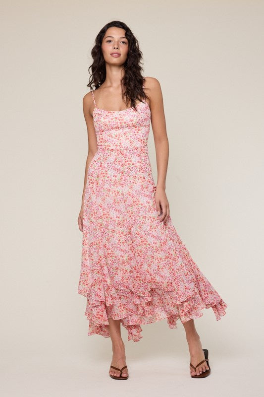 Featuring a florescene ditsy floral print midi dress with a scoop neck and adjustable straps
