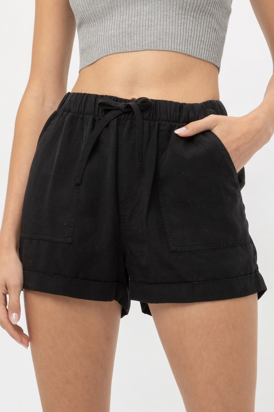 Featuring a loose fit short with an elastic wasit band and draw string to tighten in the color black