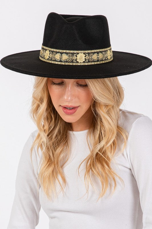 Featuring a gorgeous fedora hat with a decorative detailed band in the color black