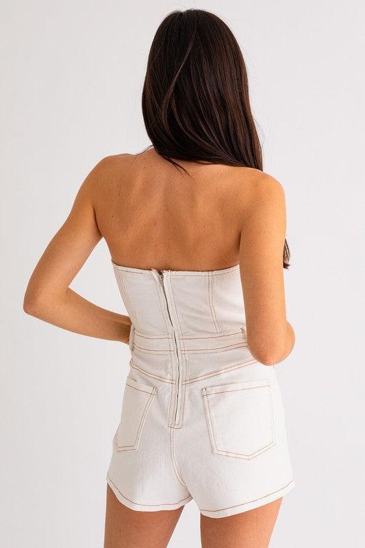 white denim mini romper with contrast stitching.