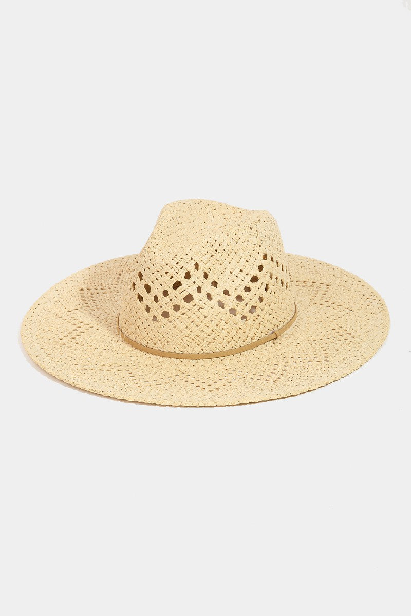 Featuring a wide brim woven hat with thin belt detail in the color ivory 