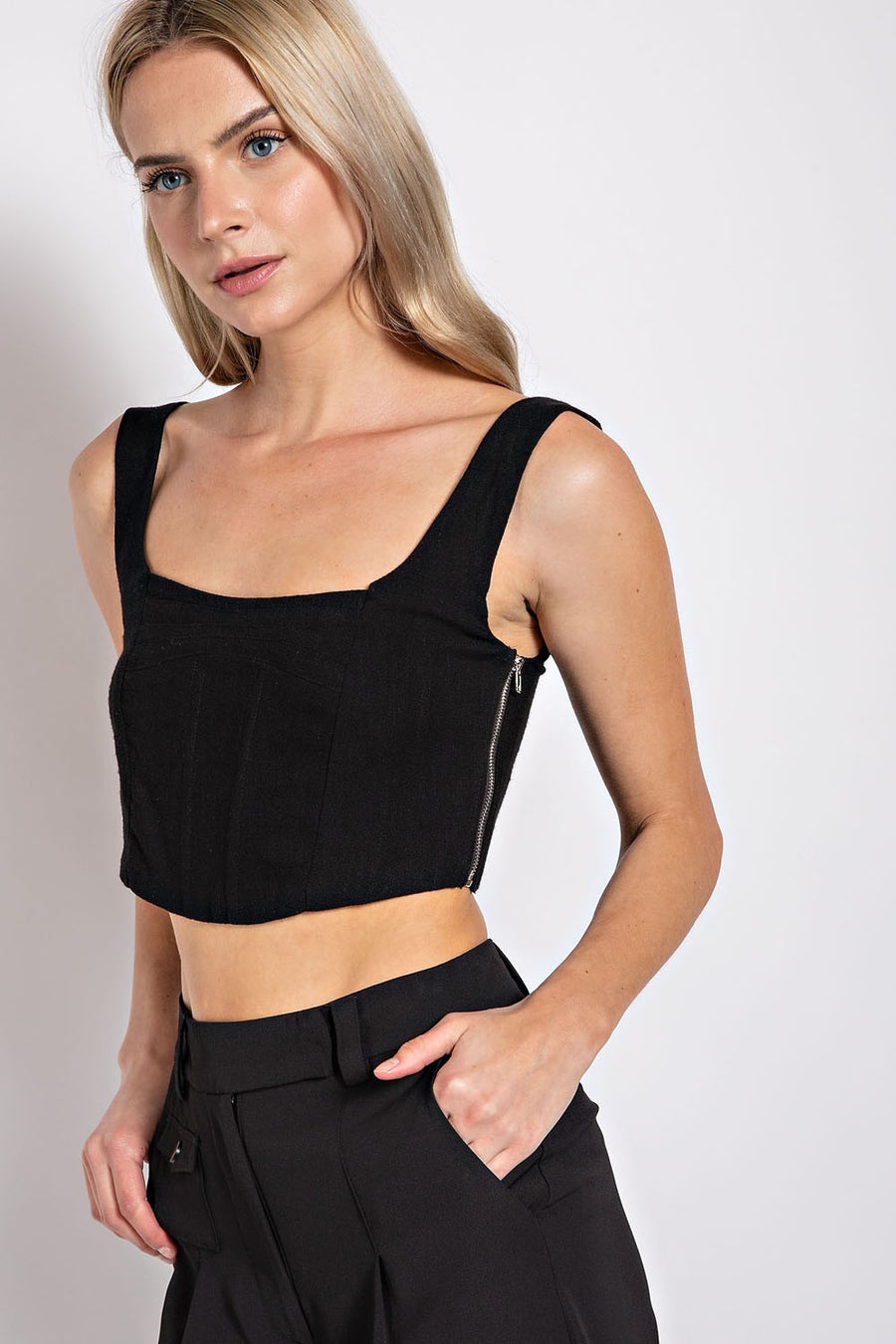Linen crop top featuring pleated details and zipper. 