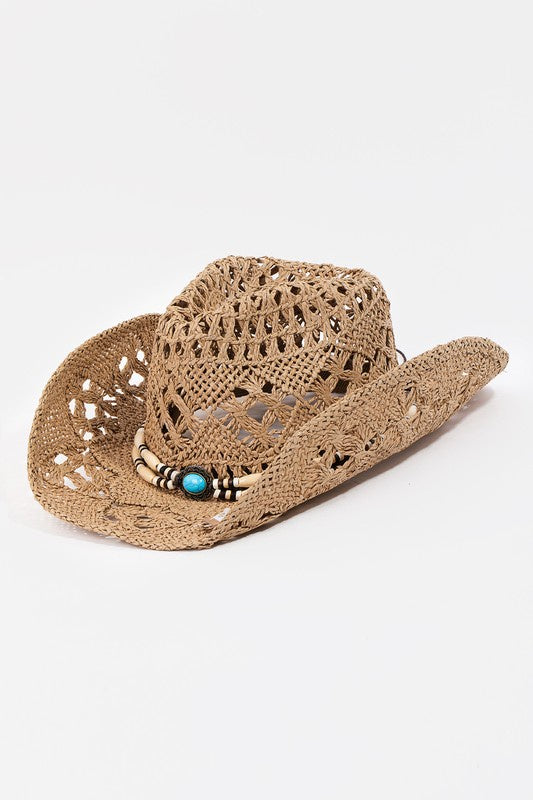 Featuring a straw hat with a curved brim with decorative strap detail in the color khaki