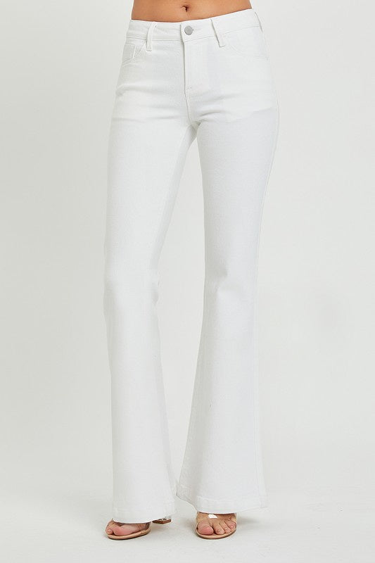 Featuring a low rise flare pant in the color white