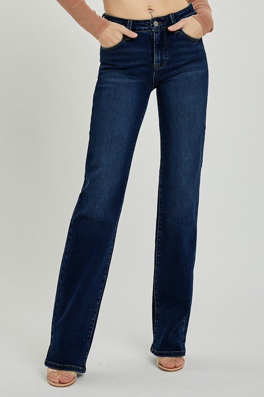 Featuring a mid rise long straight leg jean in the color dark