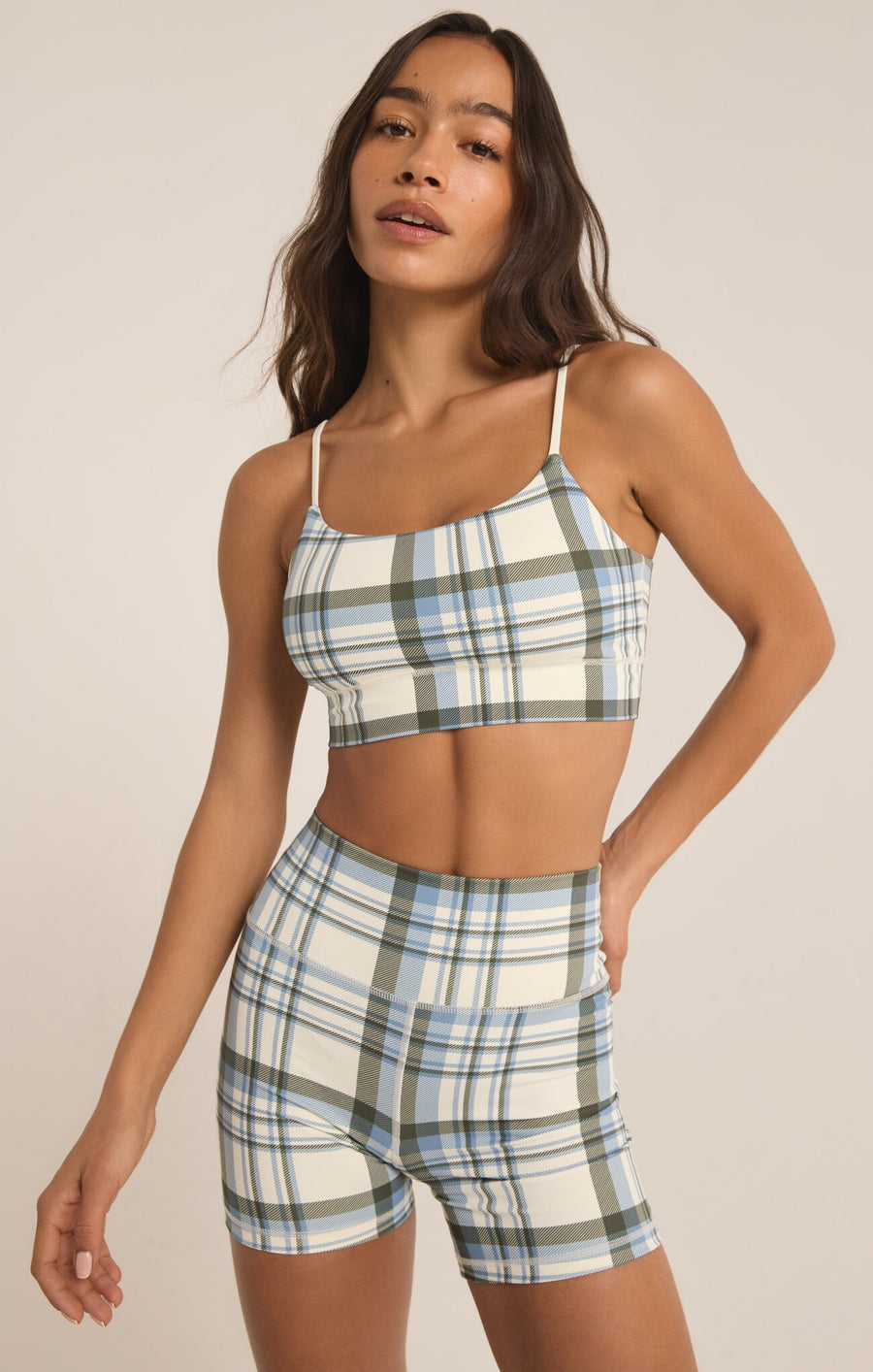 Featuring a plaid print bra in the color sandstone