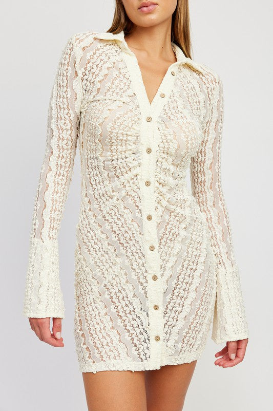 Featuring a longsleeve lace button up mini dress in the color ivory
