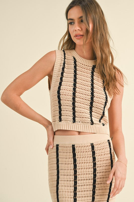 Pairs with the mtaching Emmit Midi Skirt  Featuring a cropped striped crochet tank in the color Tan/Black