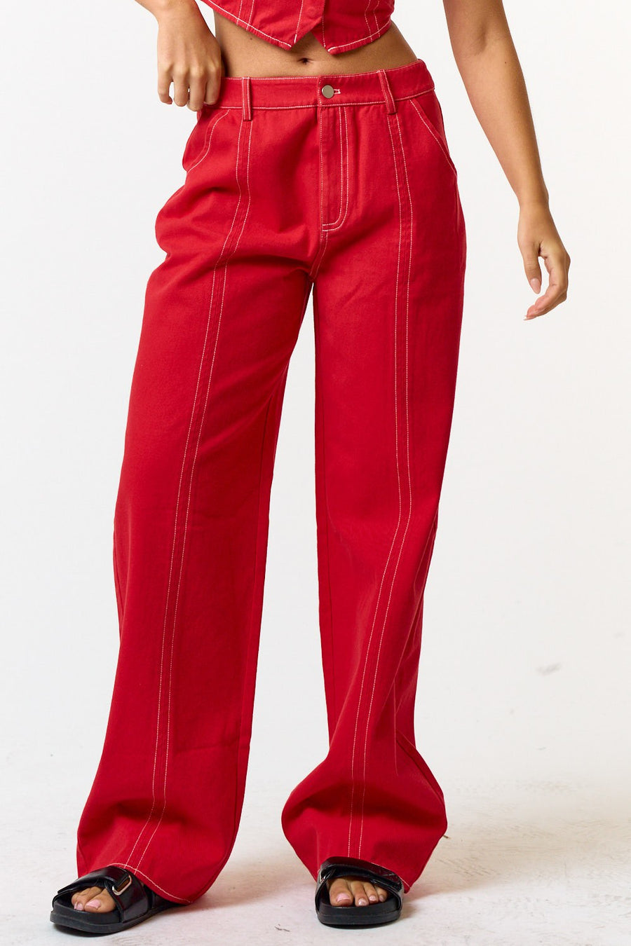 red, wide leg pants with white contrast stitching.