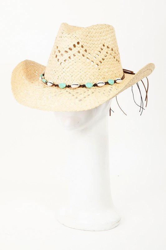 Featuring a woven hat with a shell/beaded belt detail in the color ivory 