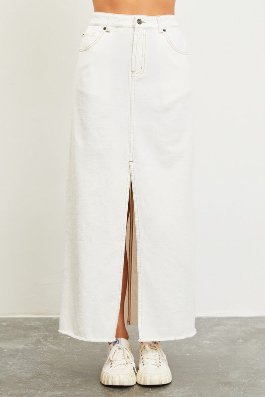 Featuring a Denim Midi skirt with contrastive stitching and a front slit in the color white