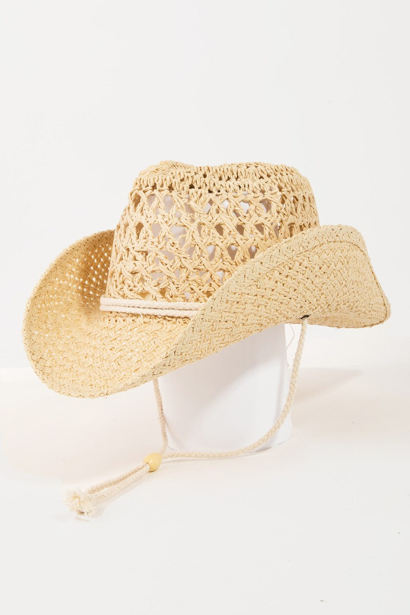 Featuring a cowboy style hat in the color beige 