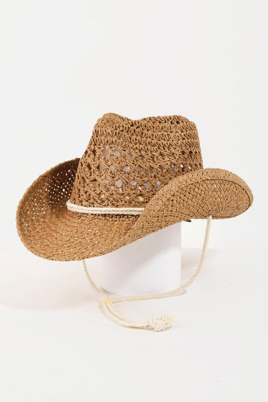 Featuring a cowboy style hat in the color brown 