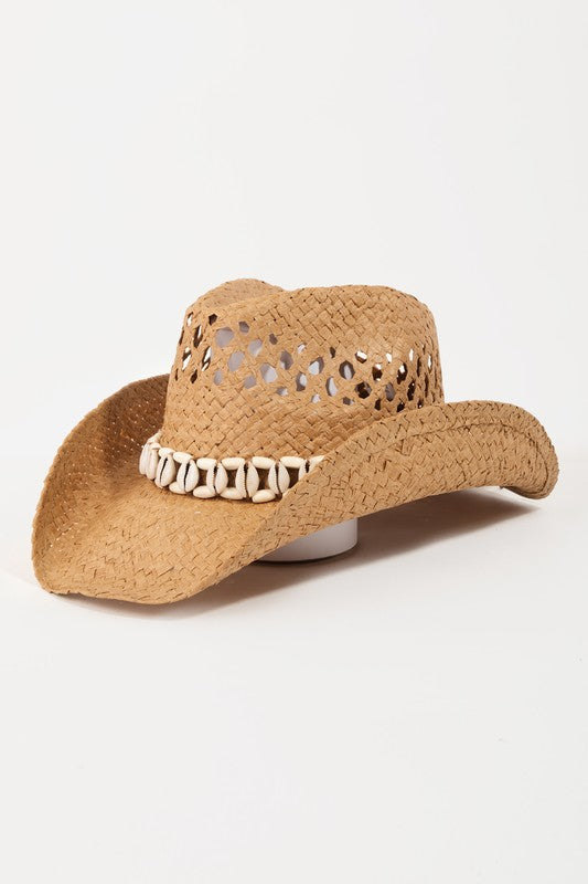 Featuring a woven sea shell lined cowboy style hat in the color brown 