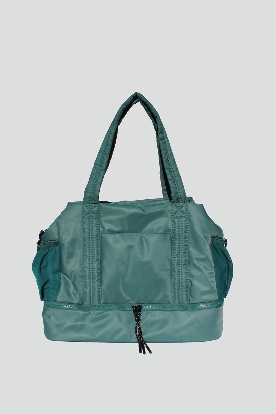 Featuring an over the shoulder/Crossbody duffle style bag with triple interior compartments and adjustable detachable straps in the color mint 