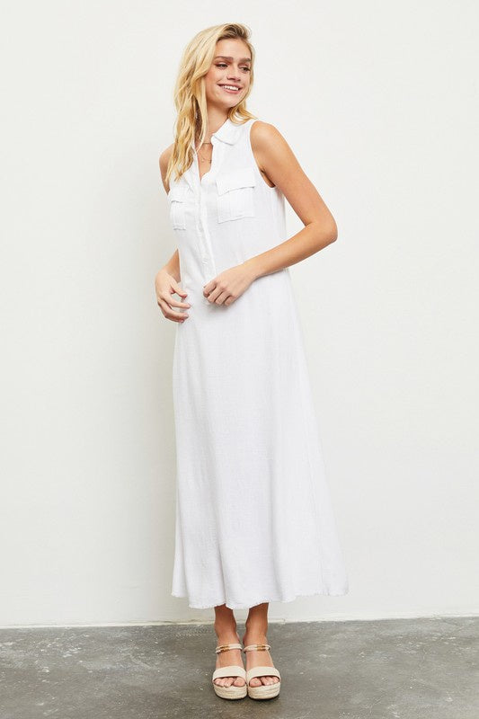 Featuring collar maxi dress with a partial button up and two chest pockets in the color white