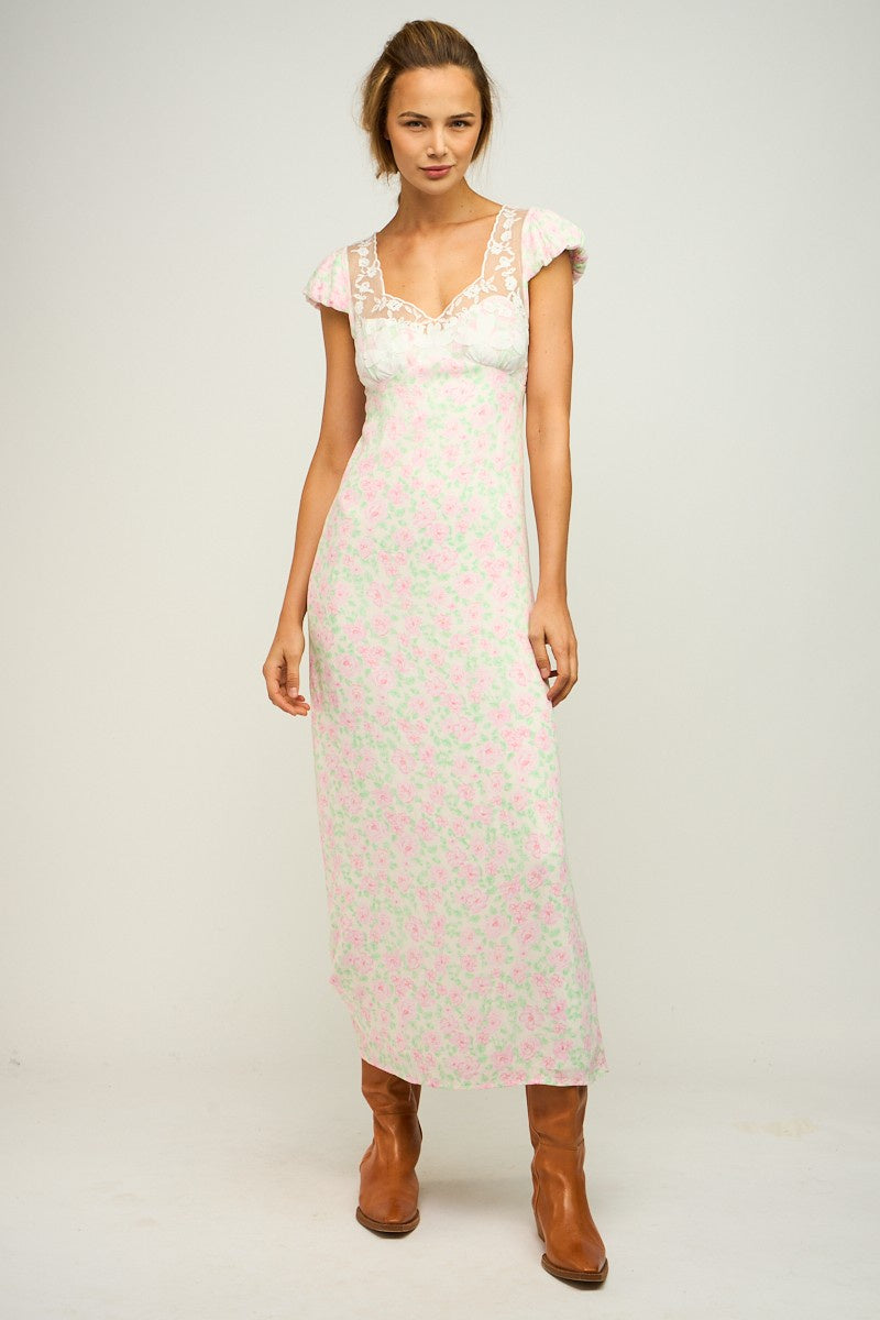 Featuring a floral short sleeve midi dress with lace detailing and an open back with tie closures in the color cream pink floral 