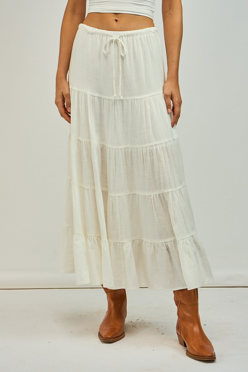 Featuring a light weight midi dress with front tie in the color white 