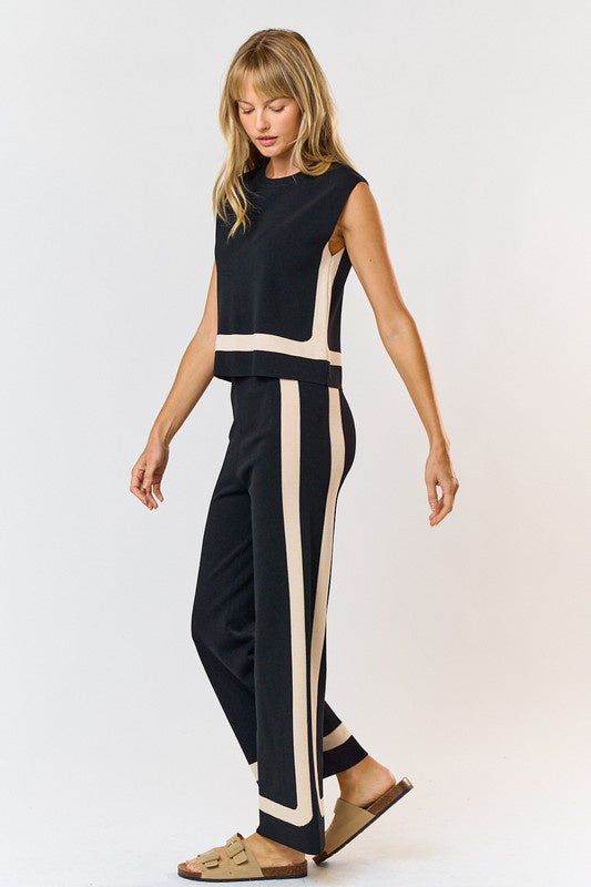 Featuring a two color contrast wide leg pants in the color black with beige