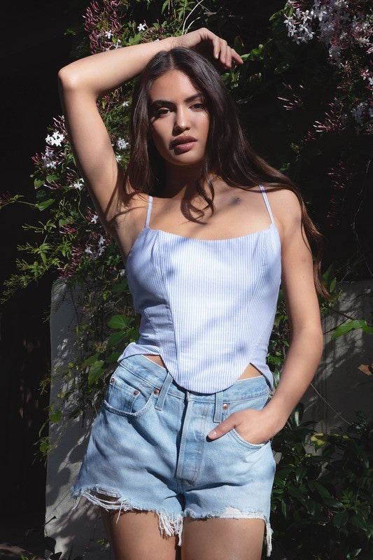 Featuring a scoop neck striped corset style top in the colors blue and white 