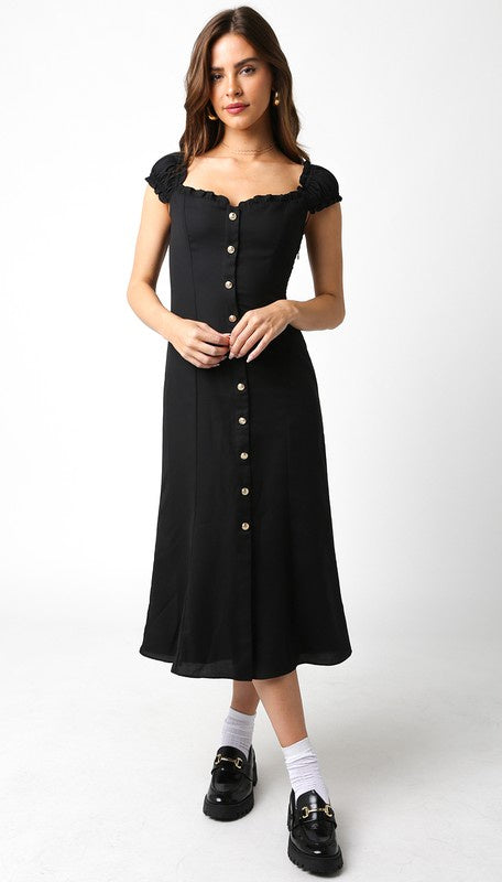 Featuring a short sleeve button front maxi dress in the color black 