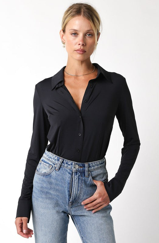 Featuring a button up long sleeve bodysuit with a collar.black 