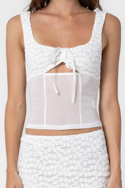 Featuring a white flower pattern tank top with a mesh body