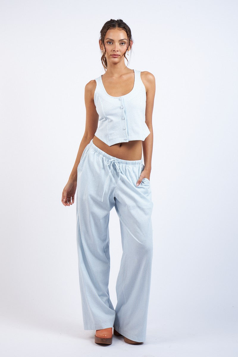 Pairs with the matching Denice striped Draw String Pant  Featuring a striped button up vest style top in the color blue stripe