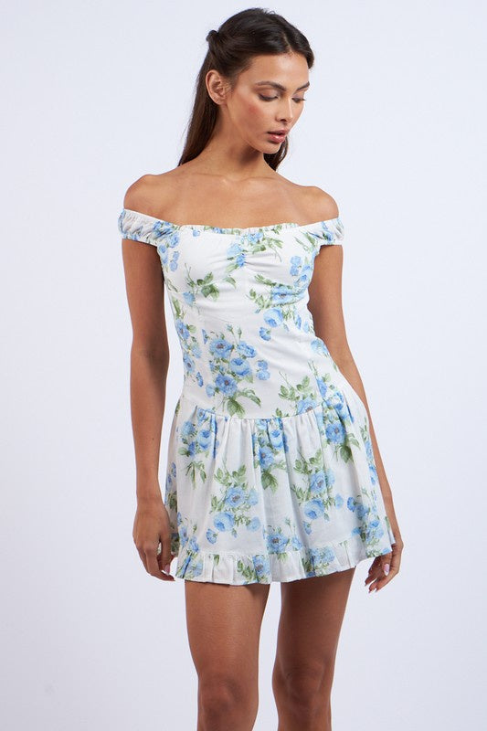 Featuring a off shoulder pleated mini dress with a printed foral design old blue floral 