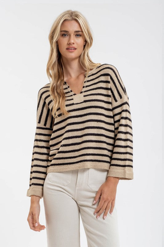 Featuring a striped wide sleeve V-neck sweater in the color taupe 