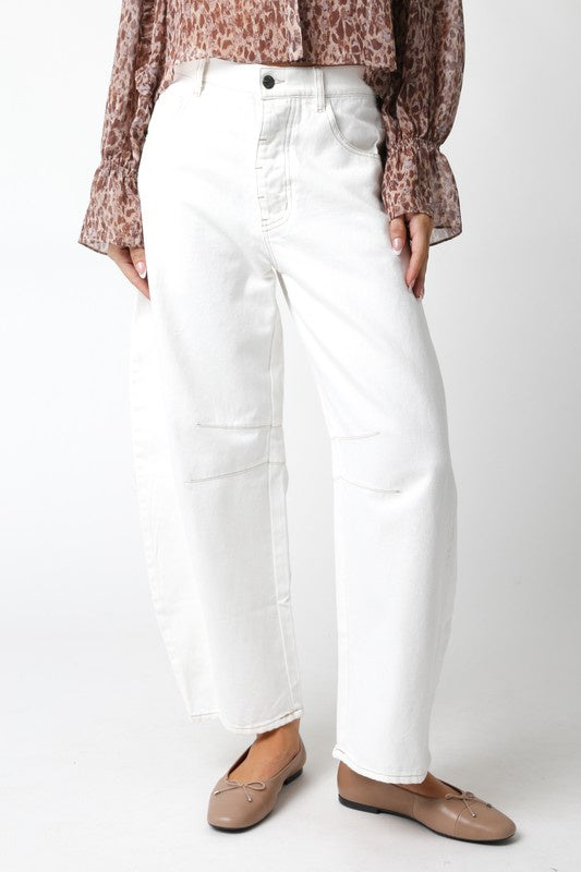 Featuring a mid rise baggy fit pant in the color white 