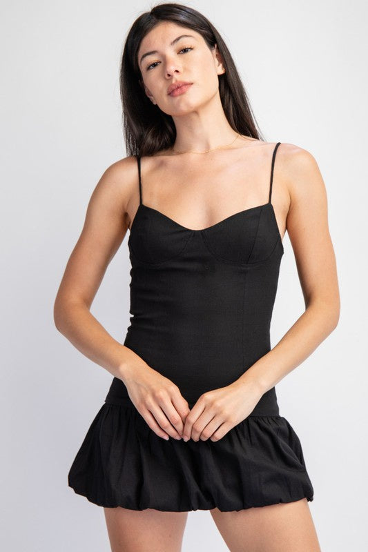 Featuring a linen cami dress with a balloon hem in the color black 