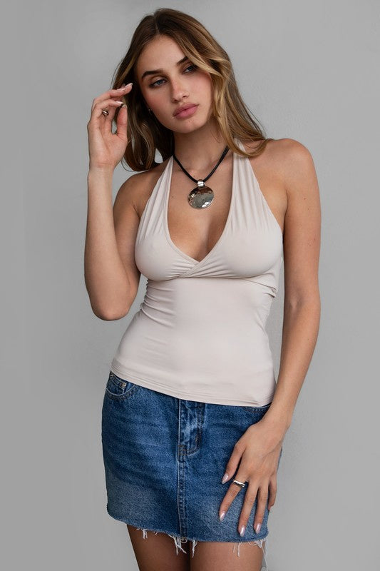 Featuring a V-neck halter top in the color oatmeal 