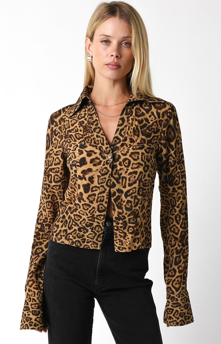 Featuring a one button closure long sleeve collard top in leopard print