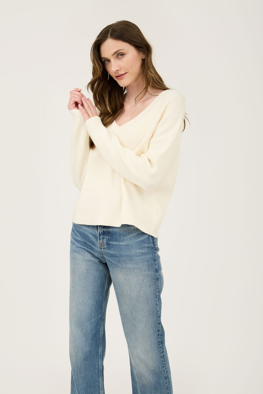 Featuring a V-neck ribbed sweater in the color oatmeal 