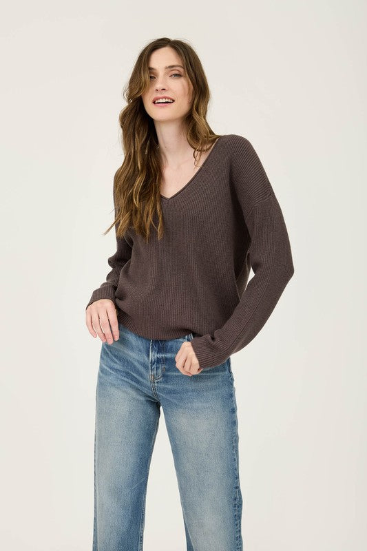 Featuring a V-neck ribbed sweater in the color charcoal 