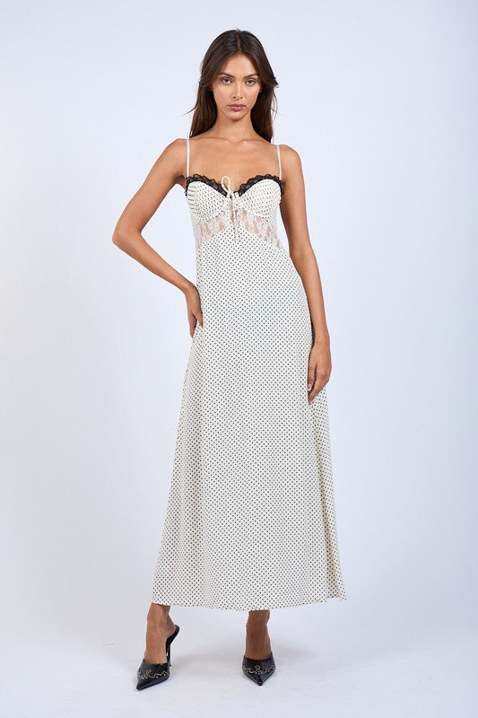 Featuring a polka dot midi dress with sweetheart neckline with floral embroidered lace