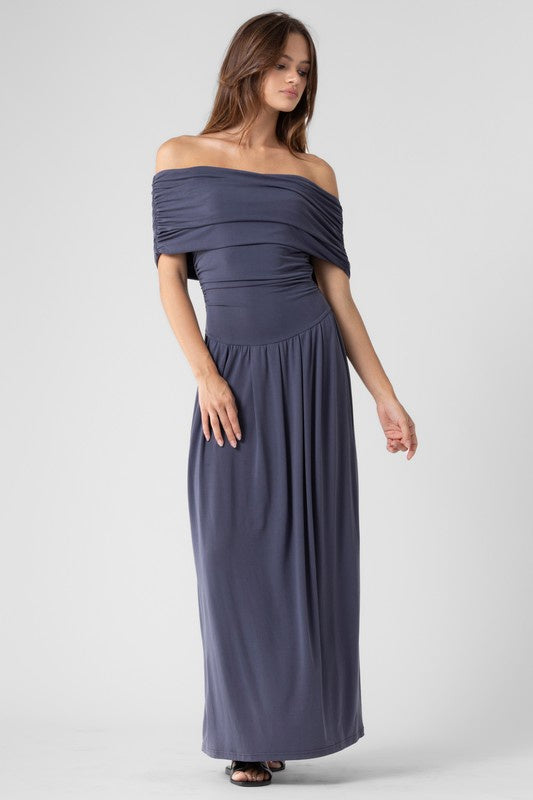 Featuring an off shoulder drop waist maxi dress in the color navy 