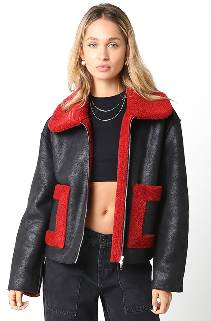 Featuring a contrast zipper collard faux leather fur jacket