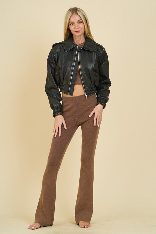 Featuring a shiny cropped jacket in the color black