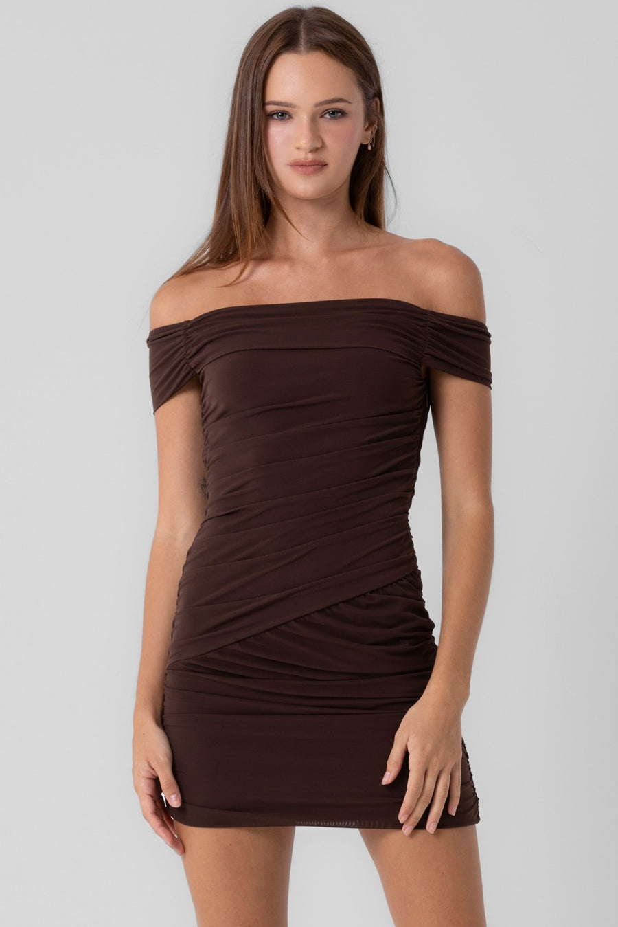 Featuring a off the shoulder mesh shirred mini dress