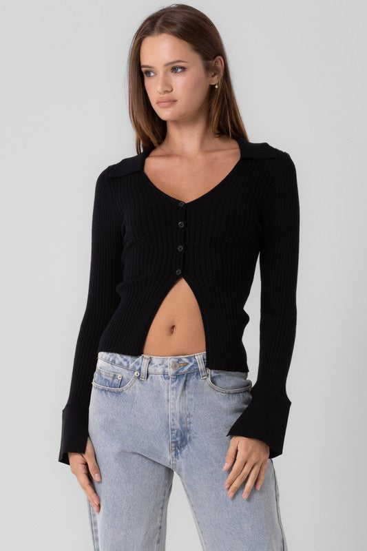 Featuring a long sleeve v-neck knitted button up top