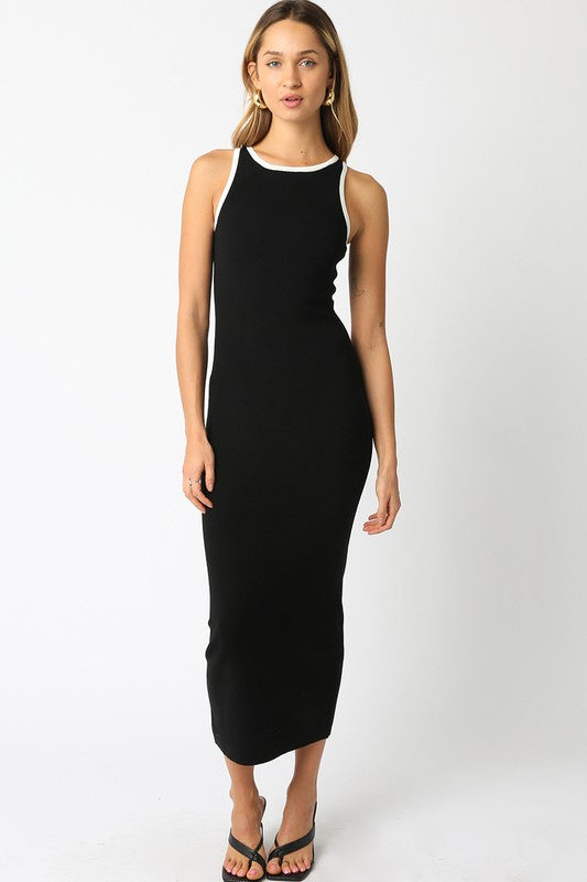 Featuring a sleeveless fitted midi dress in the color black off white 