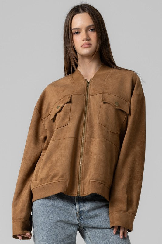 Featuring a four pocket over sized bomber jacket in the color camel 