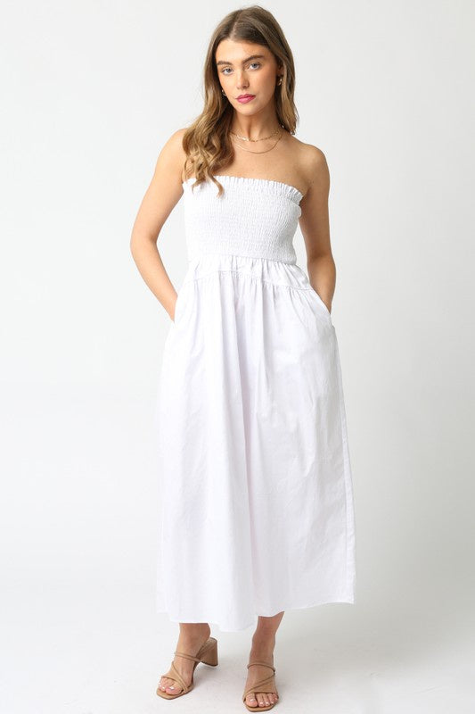 Featuring a white strapless midi dress with an a line